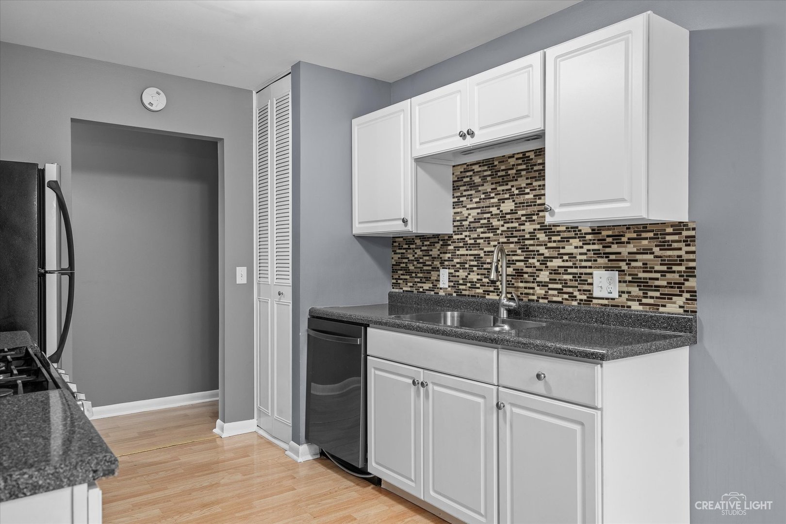 6 Ingleshire Road Montgomery, IL 60538 - Photo 6 of 16 a kitchen with a sink and cabinets