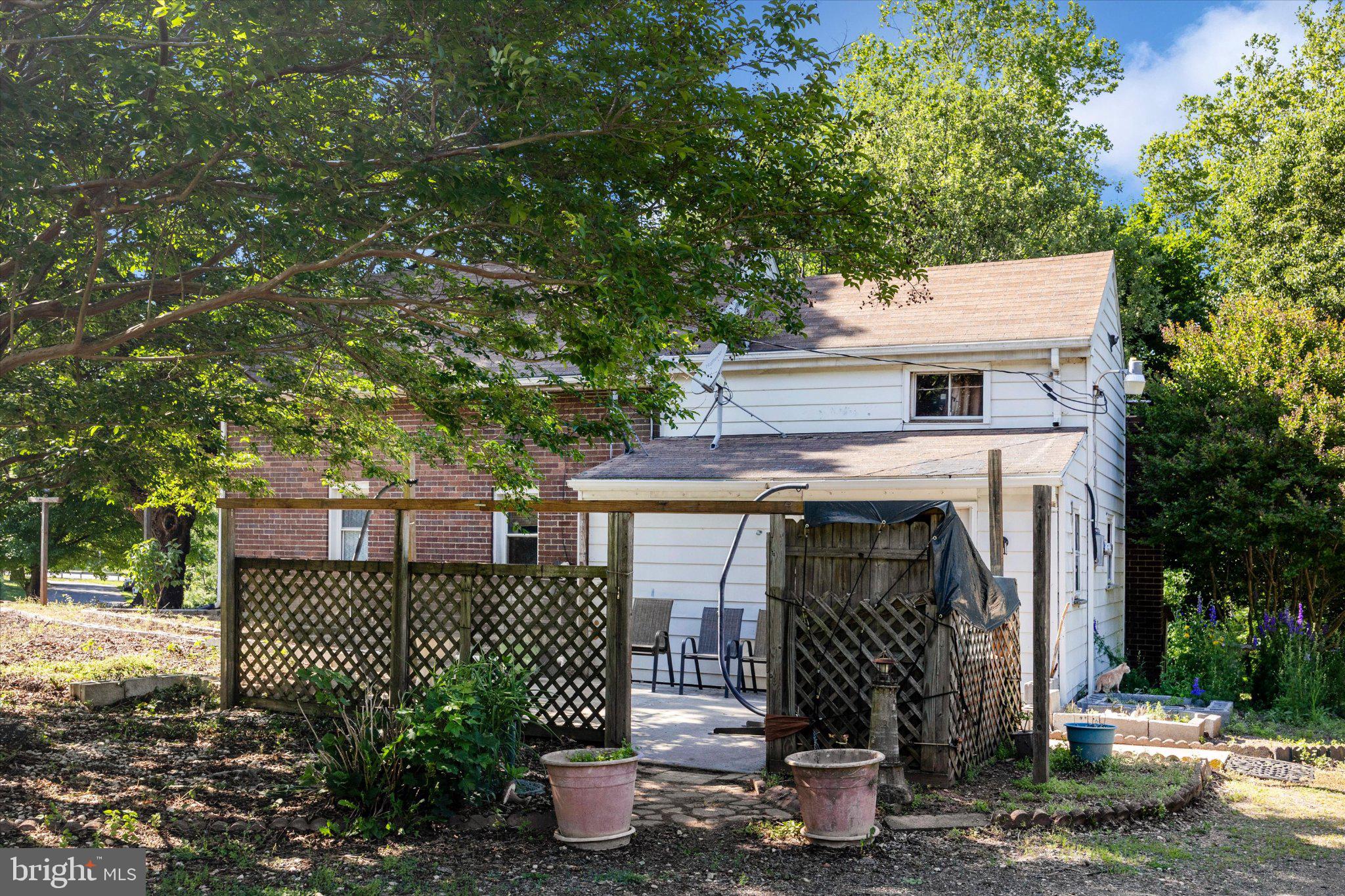 14721 Albert Staub Road Thurmont, MD 21788 - Photo 37 of 46 a front view of a house with a garden