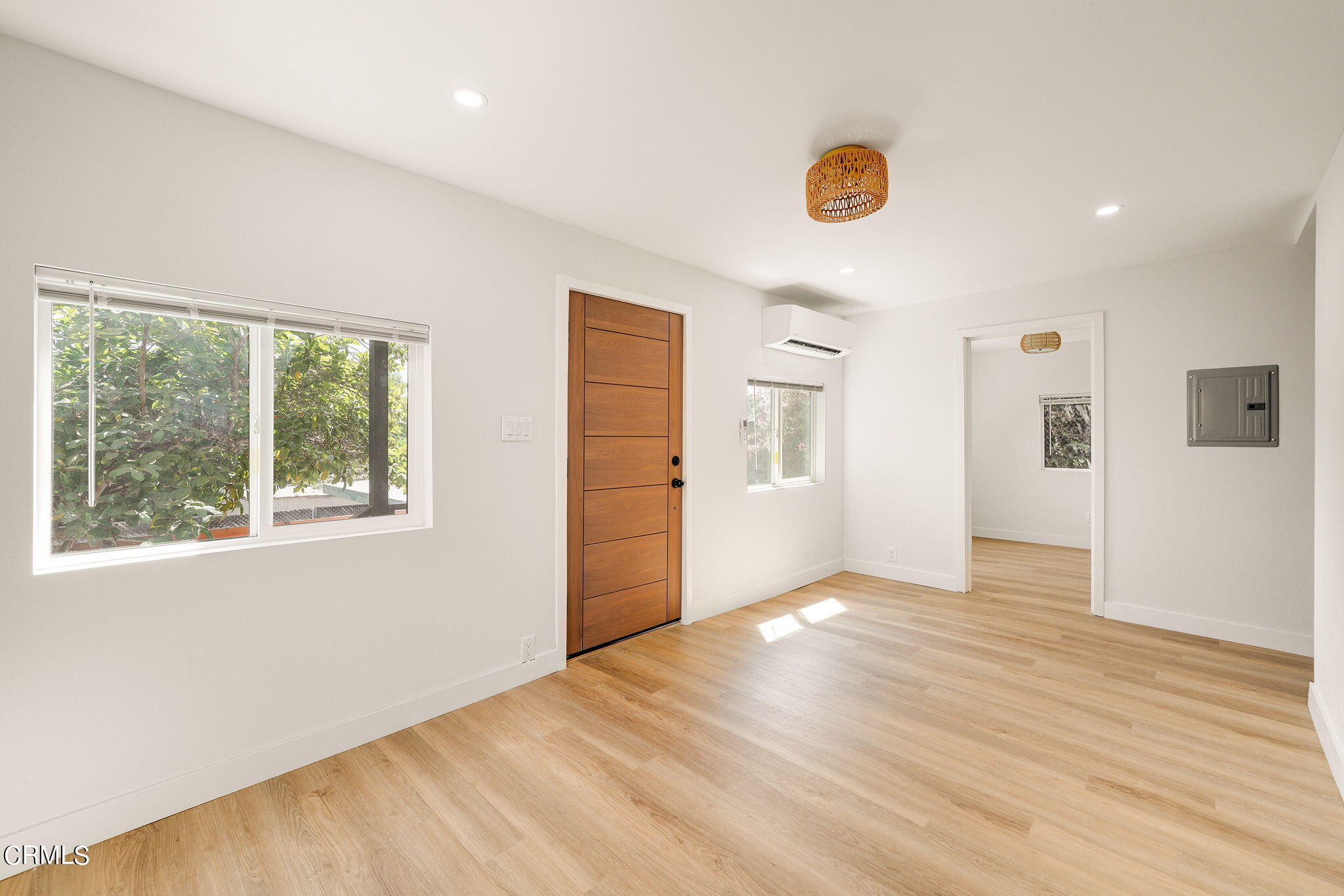 2138 1/2 Santa Ynez Street Los Angeles, CA 90026 - Photo 1 of 22 a view of an empty room with window and wooden floor