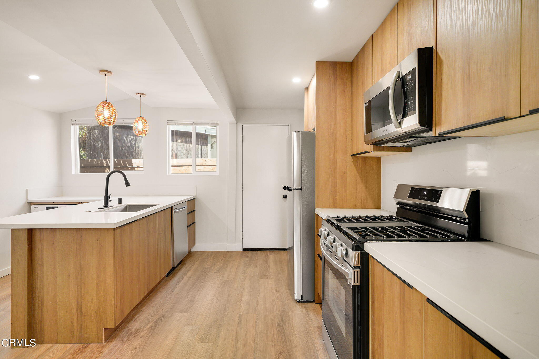 2138 1/2 Santa Ynez Street Los Angeles, CA 90026 - Photo 11 of 22 a kitchen that has a sink and a stove