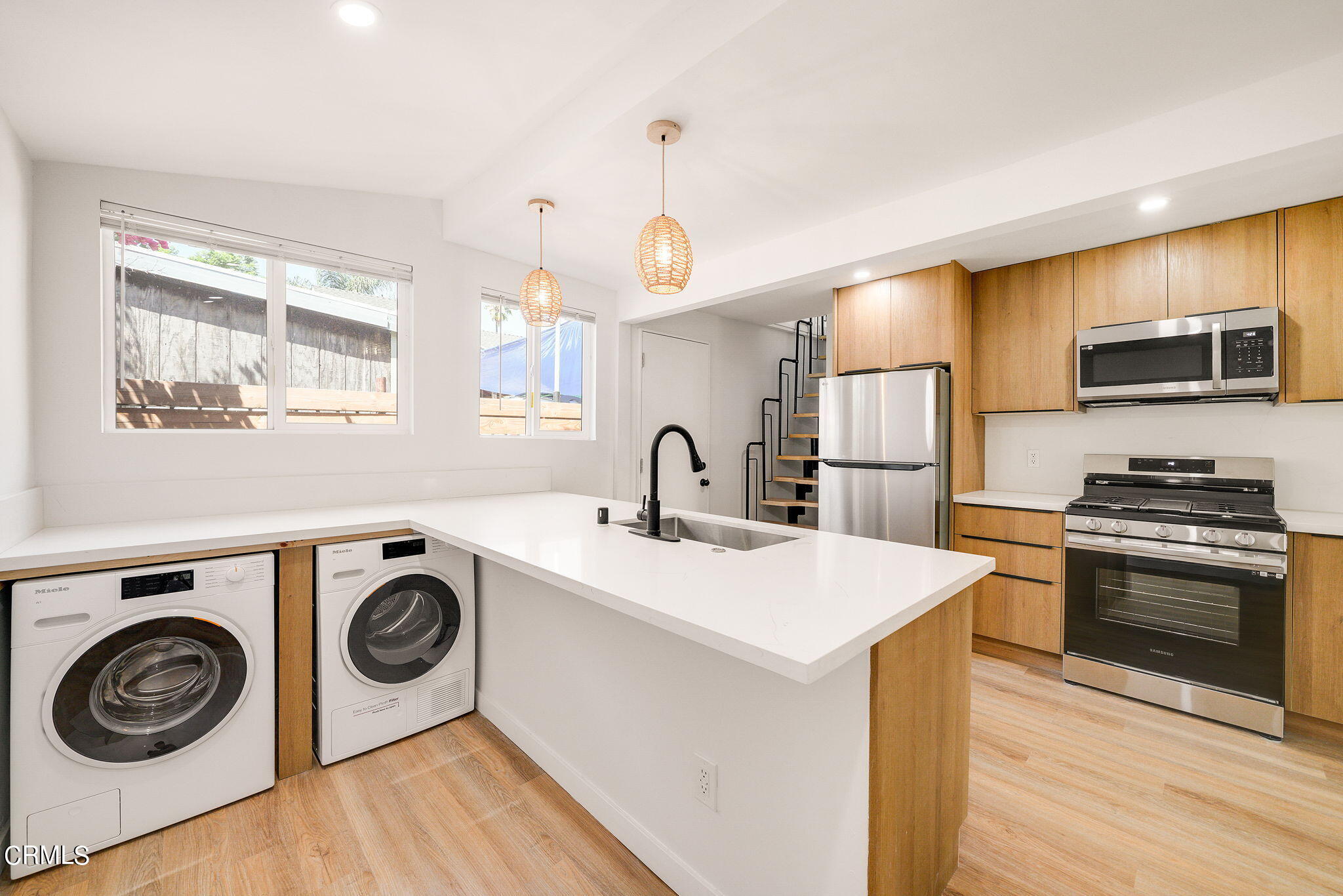 2138 1/2 Santa Ynez Street Los Angeles, CA 90026 - Photo 14 of 22 a kitchen with kitchen island a stove and a sink