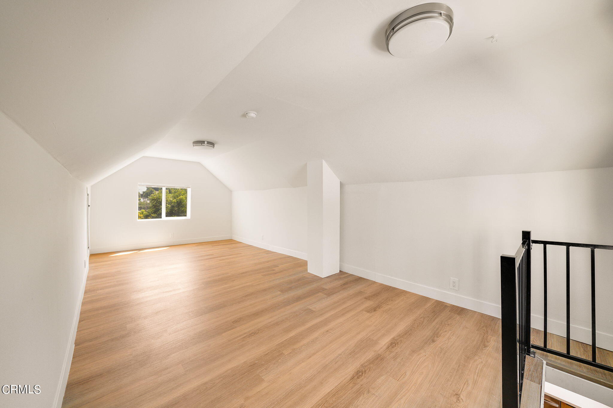 2138 1/2 Santa Ynez Street Los Angeles, CA 90026 - Photo 17 of 22 a view of a room with wooden floor and a window