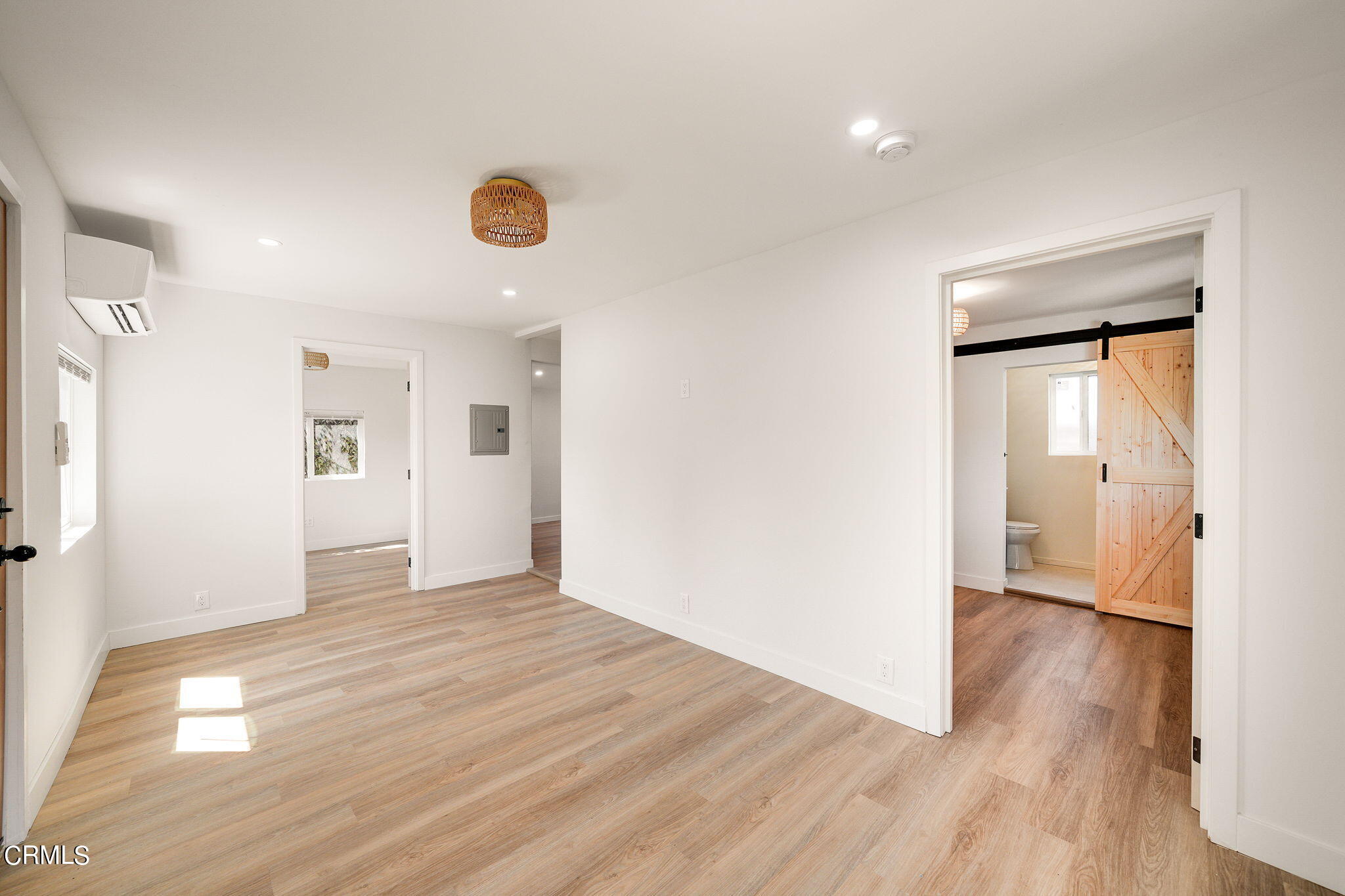 2138 1/2 Santa Ynez Street Los Angeles, CA 90026 - Photo 2 of 22 a view of a room with wooden floor and a window