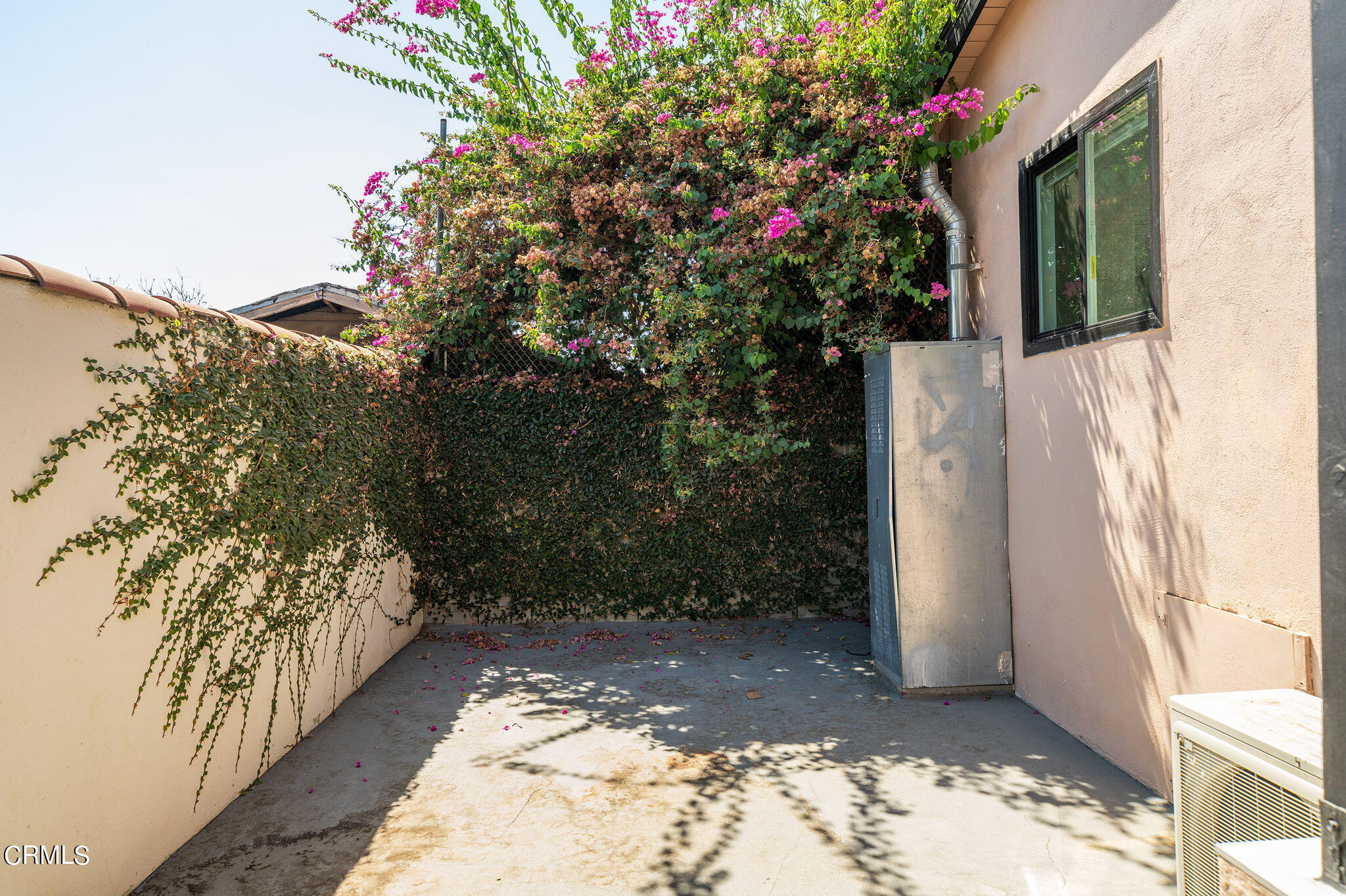 2138 1/2 Santa Ynez Street Los Angeles, CA 90026 - Photo 21 of 22 a view of a house with a flower garden