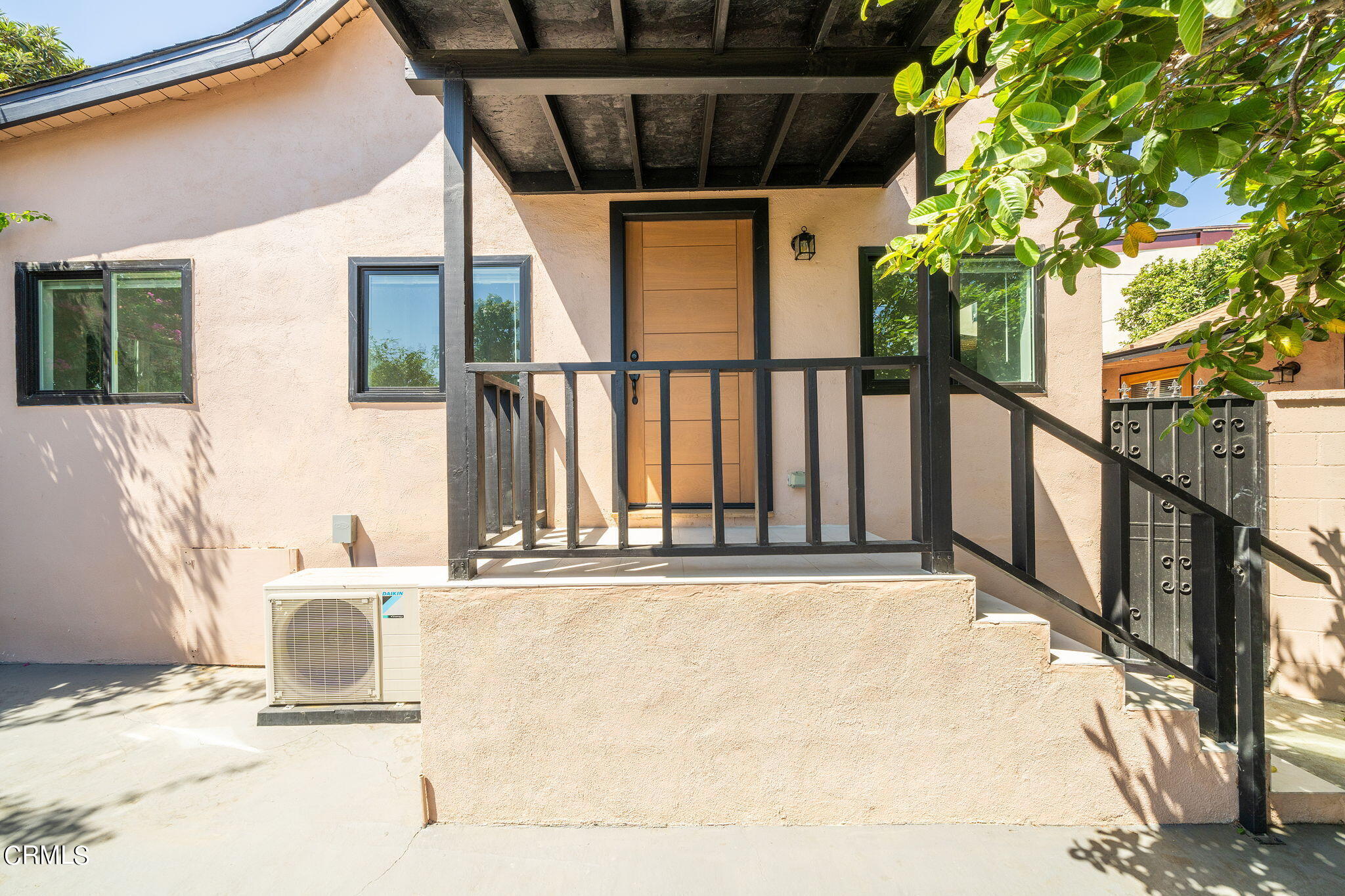2138 1/2 Santa Ynez Street Los Angeles, CA 90026 - Photo 22 of 22 a view of a balcony with floor to ceiling window and tree