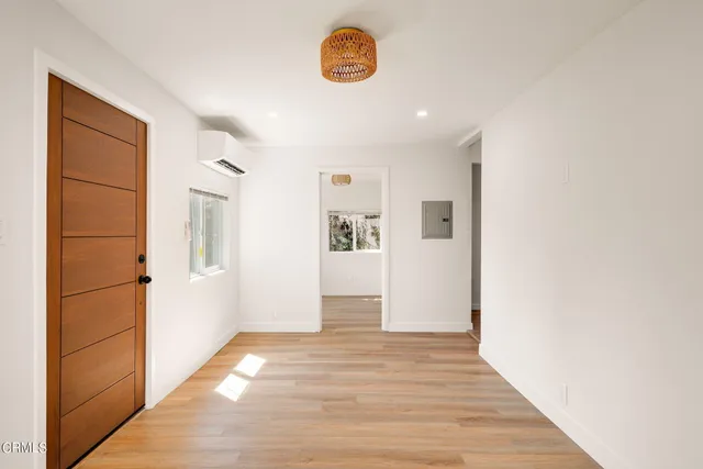 a view of a refrigerator in kitchen and wooden floor