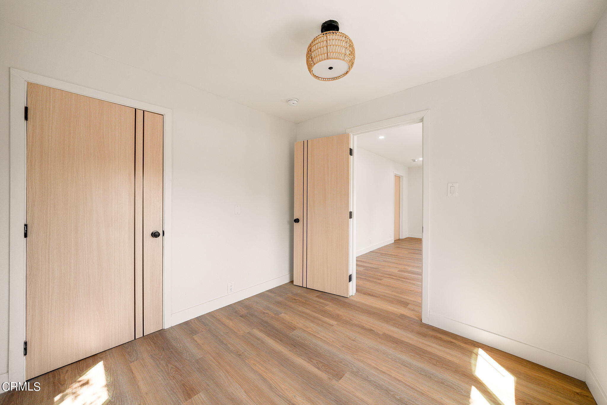 2138 1/2 Santa Ynez Street Los Angeles, CA 90026 - Photo 5 of 22 a view of an empty room with wooden floor