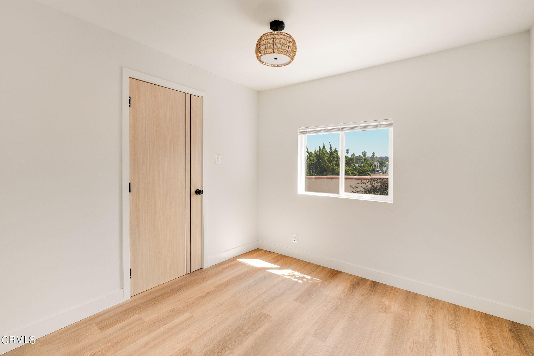 2138 1/2 Santa Ynez Street Los Angeles, CA 90026 - Photo 6 of 22 a view of a room with wooden floor and window