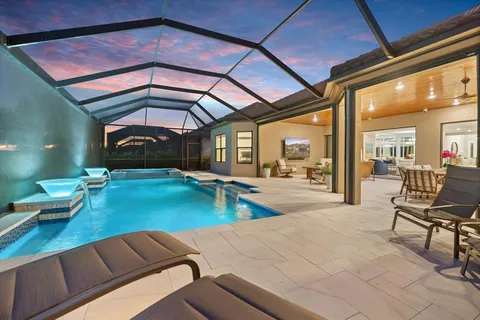 a spacious bathroom with a double vanity sink a mirror and a shower