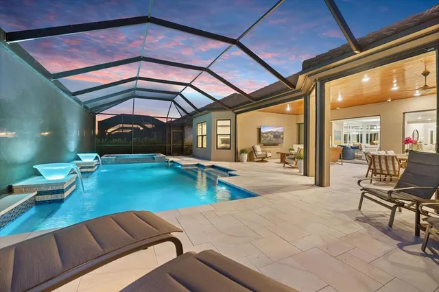 a spacious bathroom with a double vanity sink a mirror and a shower