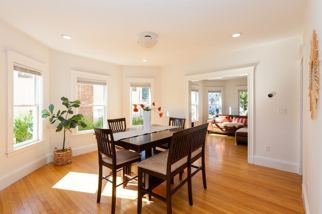 9 Trowbridge Street Arlington, MA 02474 - Photo 15 of 22 a view of a dining room with furniture and wooden floor