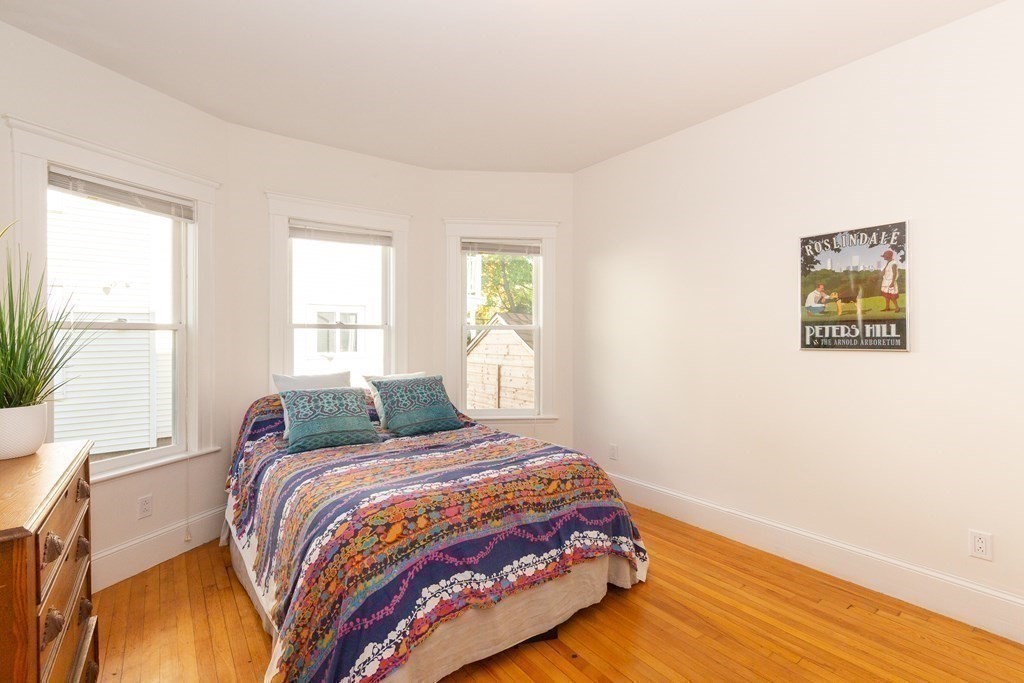 9 Trowbridge Street Arlington, MA 02474 - Photo 17 of 22 a bedroom with a bed and a window