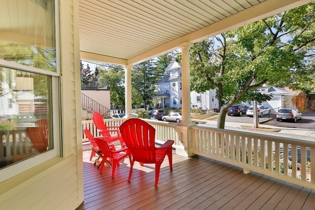 9 Trowbridge Street Arlington, MA 02474 - Photo 21 of 22 a view of a porch with furniture and wooden floor