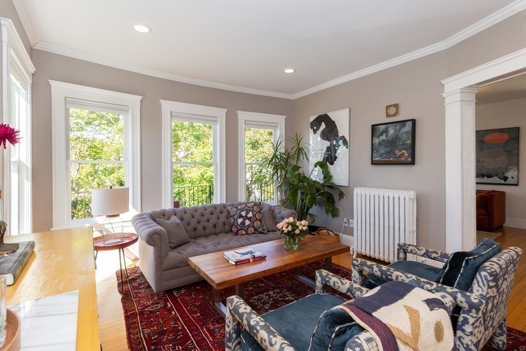 9 Trowbridge Street Arlington, MA 02474 - Photo 3 of 22 a living room with furniture and a large window