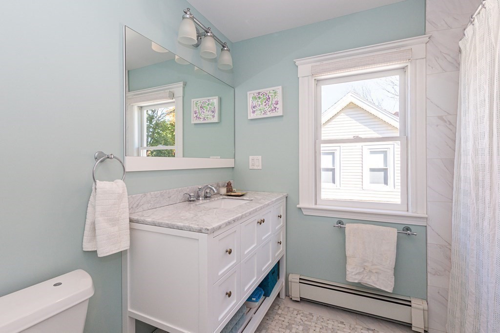 9 Trowbridge Street Arlington, MA 02474 - Photo 8 of 22 a utility room with a window dryer and washer