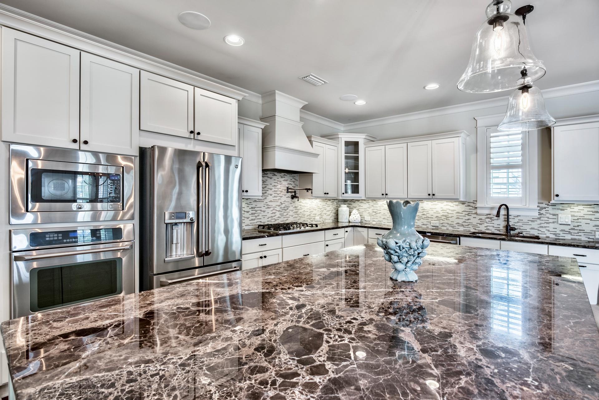 70 Pleasant Street Inlet Beach, FL 32461 - Photo 11 of 38 a large kitchen with granite countertop a large counter top stainless steel appliances and cabinets