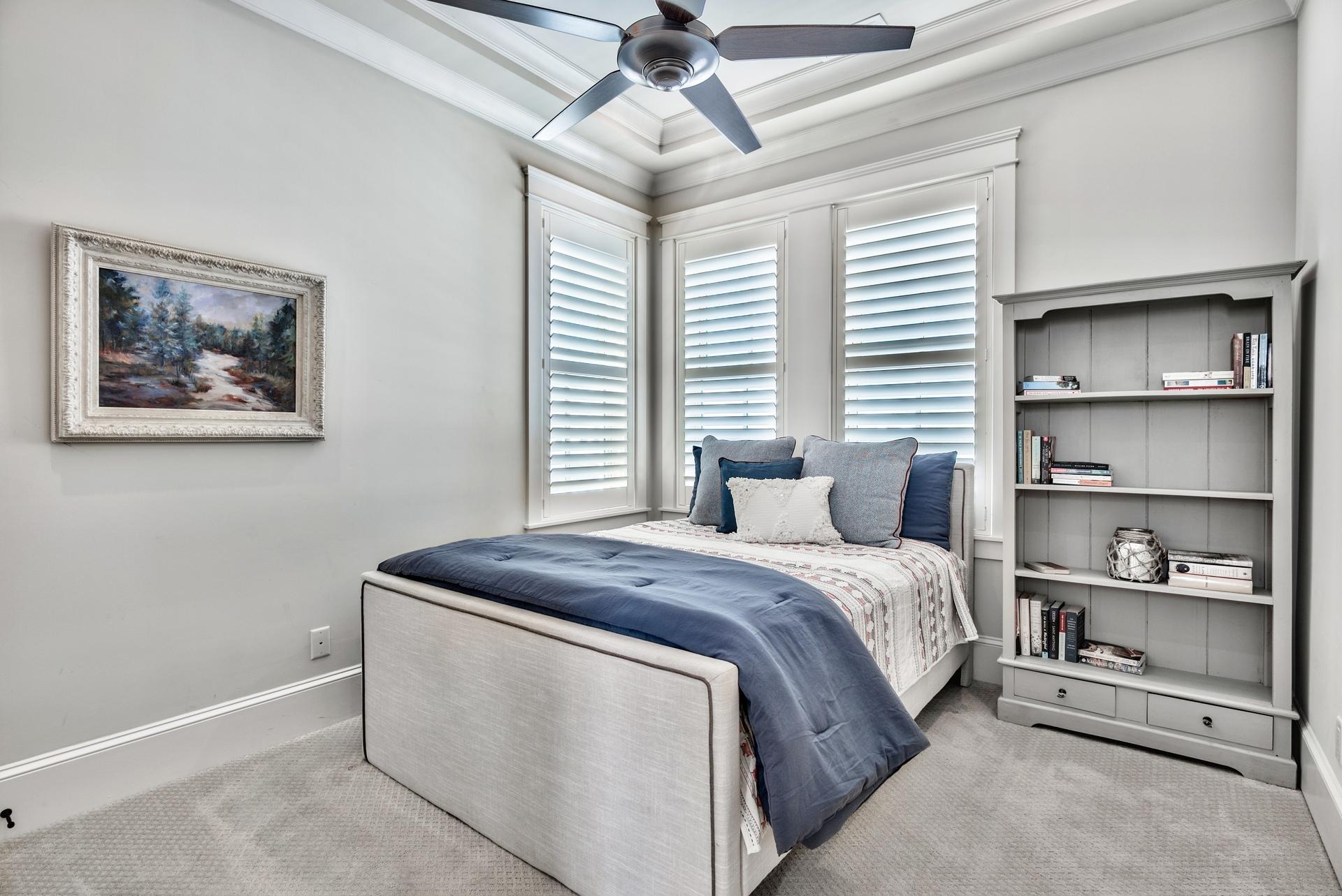 70 Pleasant Street Inlet Beach, FL 32461 - Photo 26 of 38 a bedroom with a bed and a chandelier