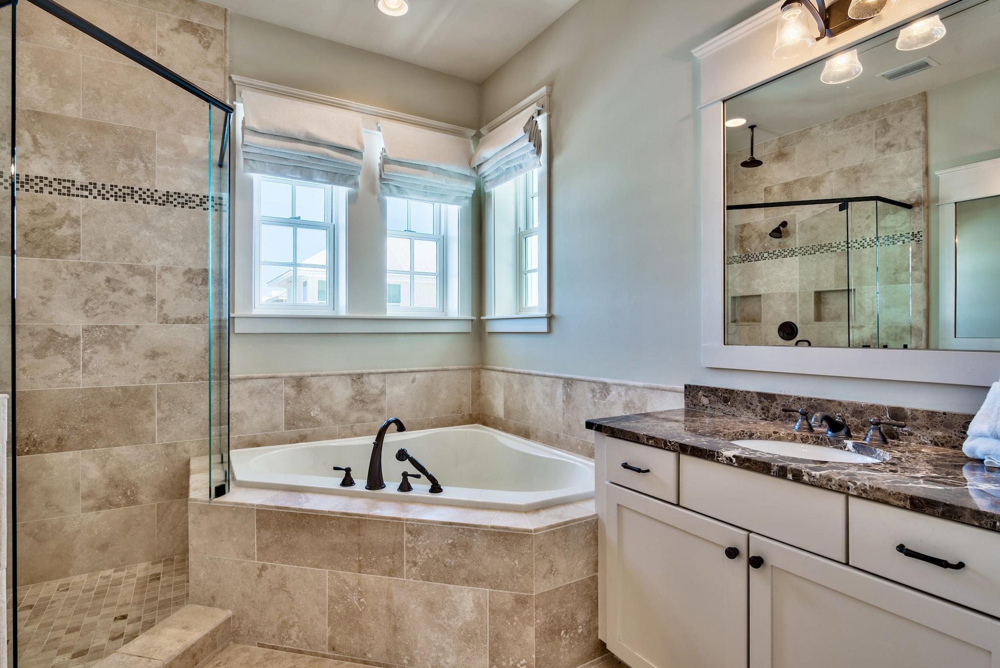 70 Pleasant Street Inlet Beach, FL 32461 - Photo 33 of 38 a bathroom with a granite countertop sink and a bathtub