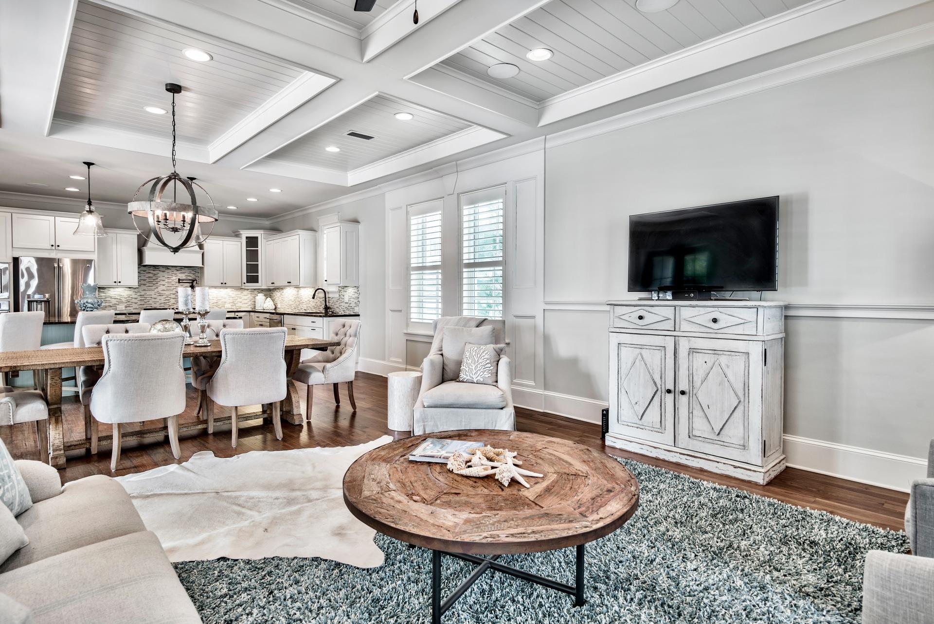 70 Pleasant Street Inlet Beach, FL 32461 - Photo 6 of 38 a living room with furniture a flat screen tv and kitchen view