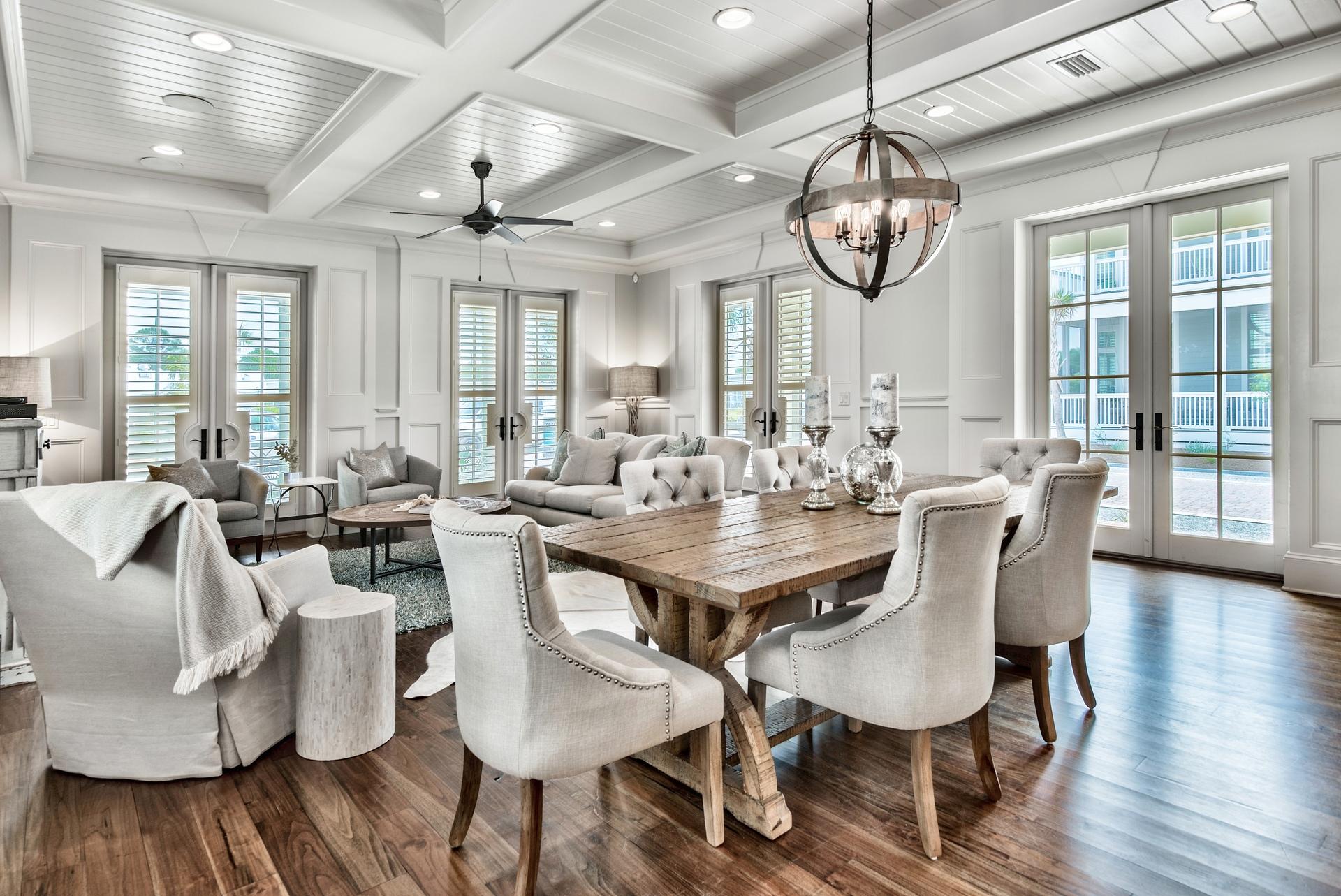 70 Pleasant Street Inlet Beach, FL 32461 - Photo 8 of 38 a dining room with wooden floor a chandelier a wooden table and chairs