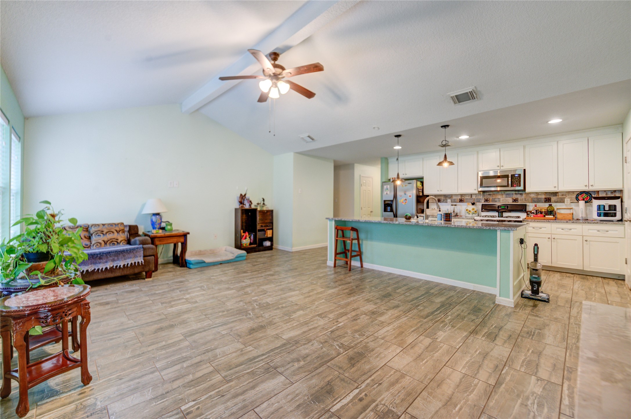 3530 Kentwood Drive Spring, TX 77380 - Photo 12 of 37 a living room with furniture and kitchen view