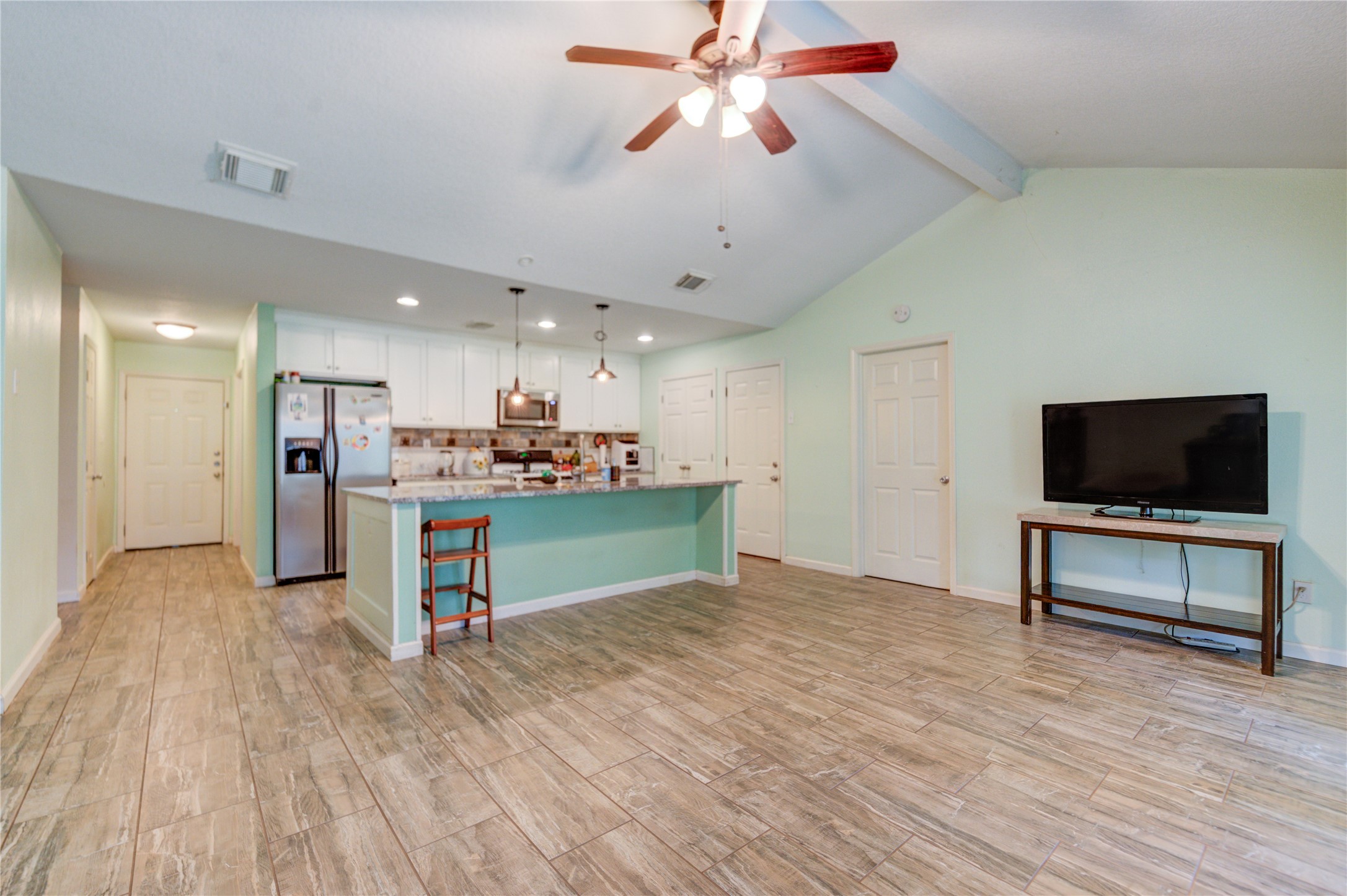 3530 Kentwood Drive Spring, TX 77380 - Photo 15 of 37 a view of a livingroom with furniture and a flat screen tv