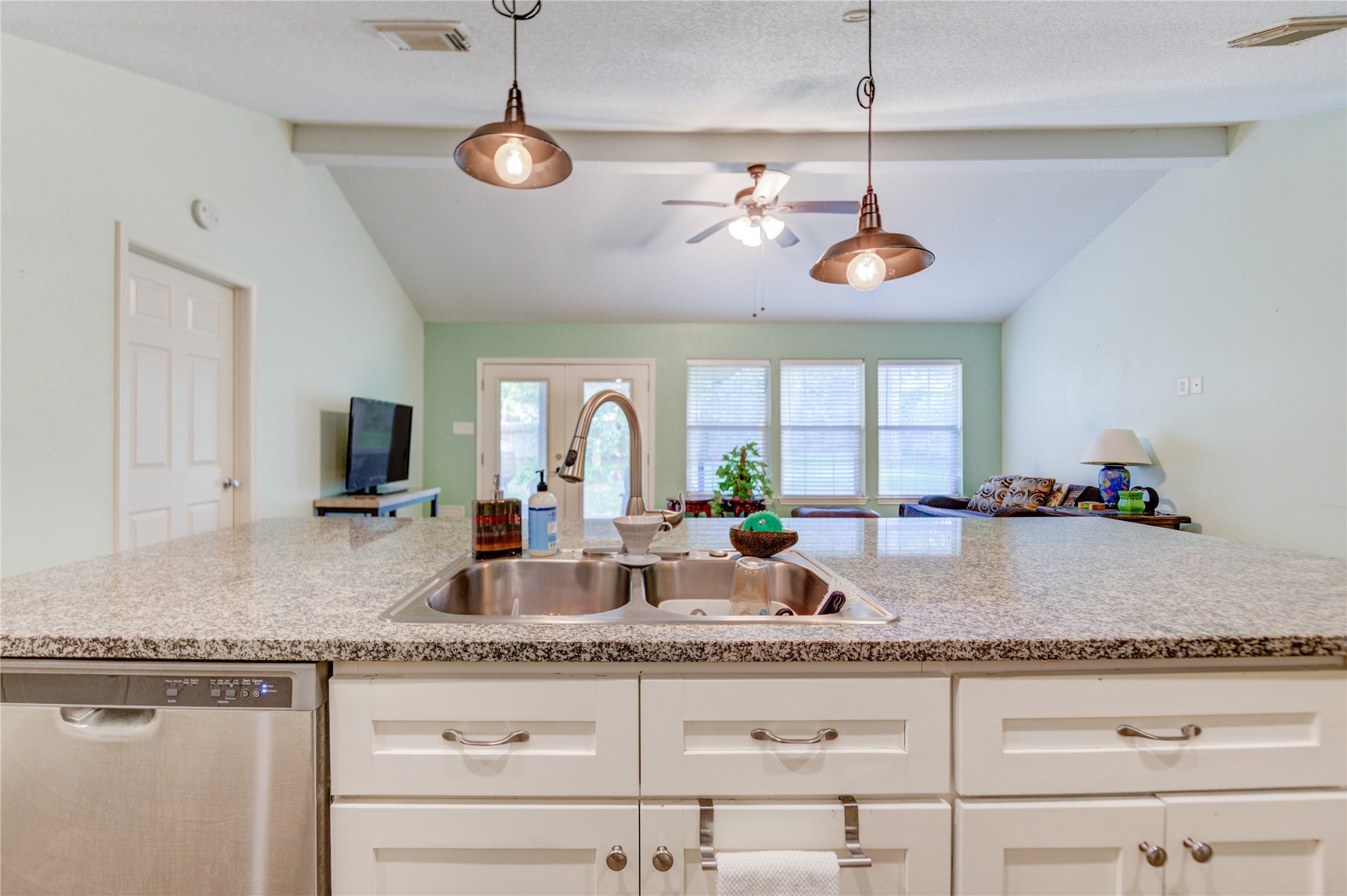 3530 Kentwood Drive Spring, TX 77380 - Photo 21 of 37 a kitchen with a counter space a sink and a window