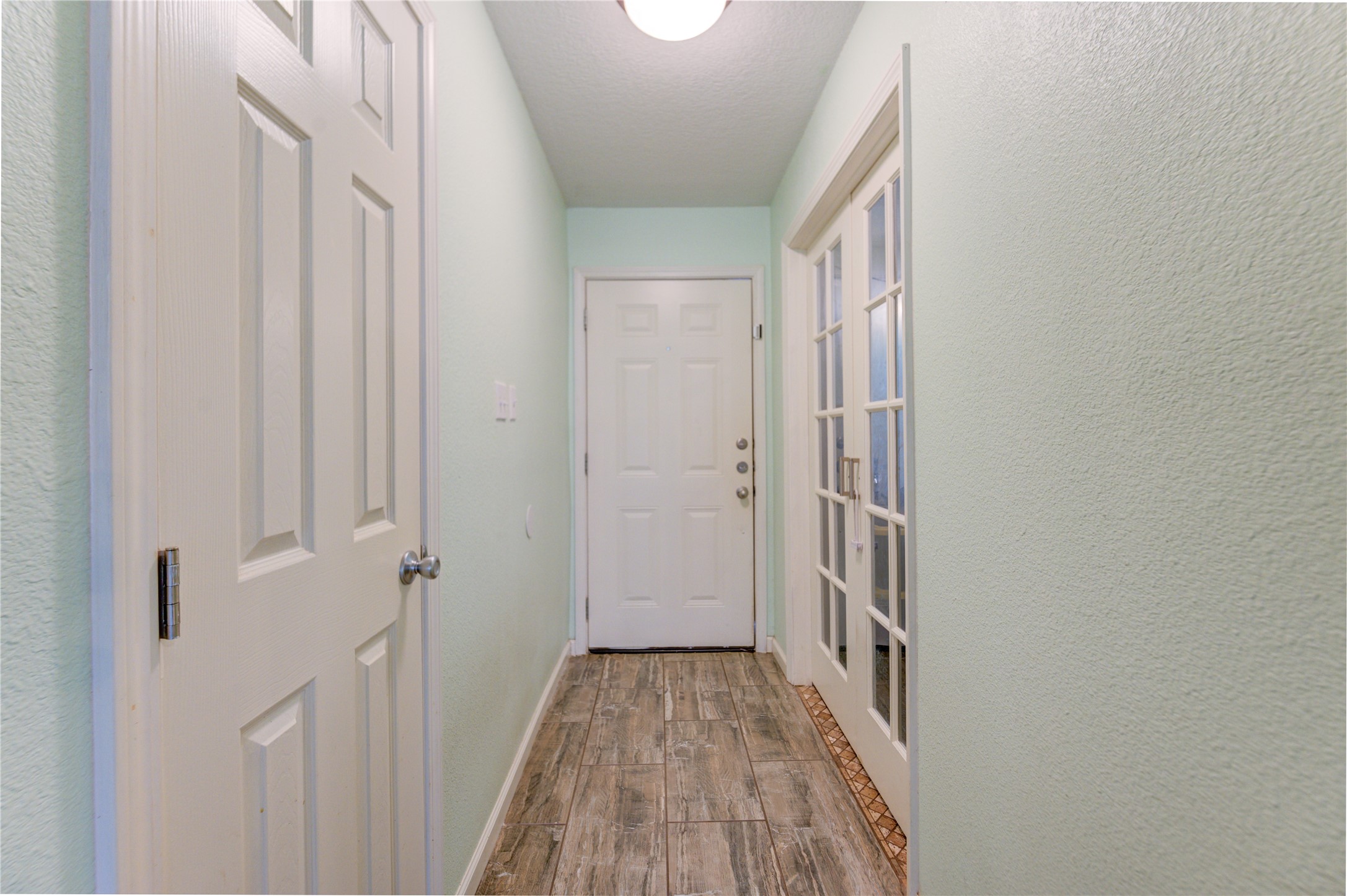 3530 Kentwood Drive Spring, TX 77380 - Photo 23 of 37 a view of a hallway with wooden floor and entryway