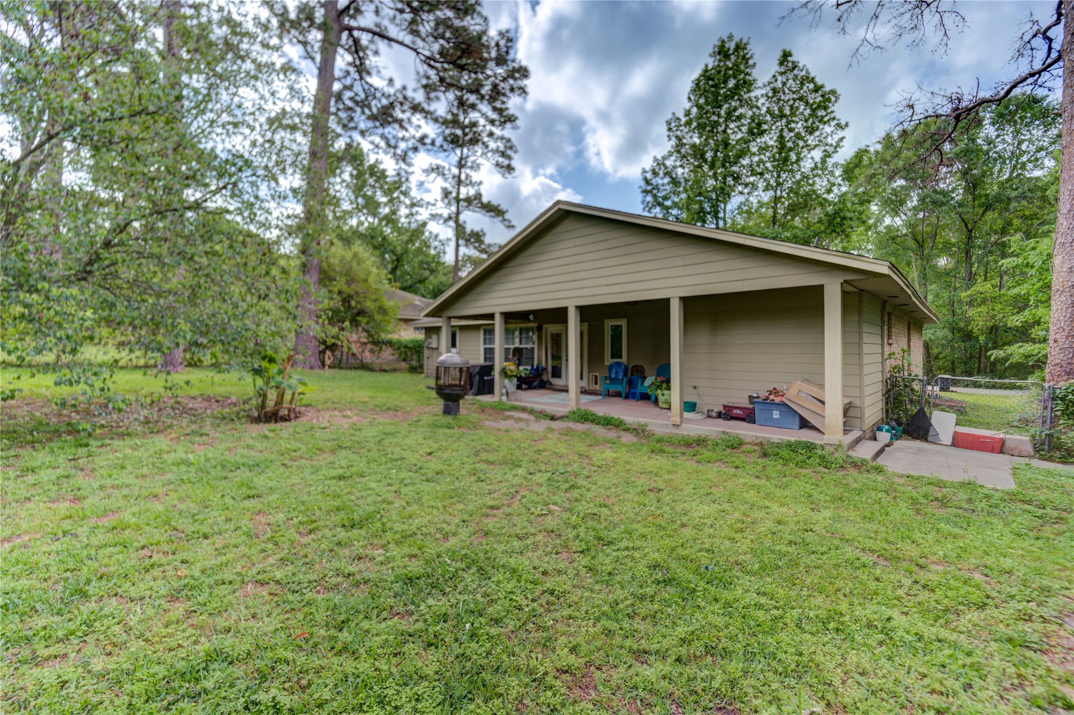 3530 Kentwood Drive Spring, TX 77380 - Photo 35 of 37 a view of a house with a yard and sitting area