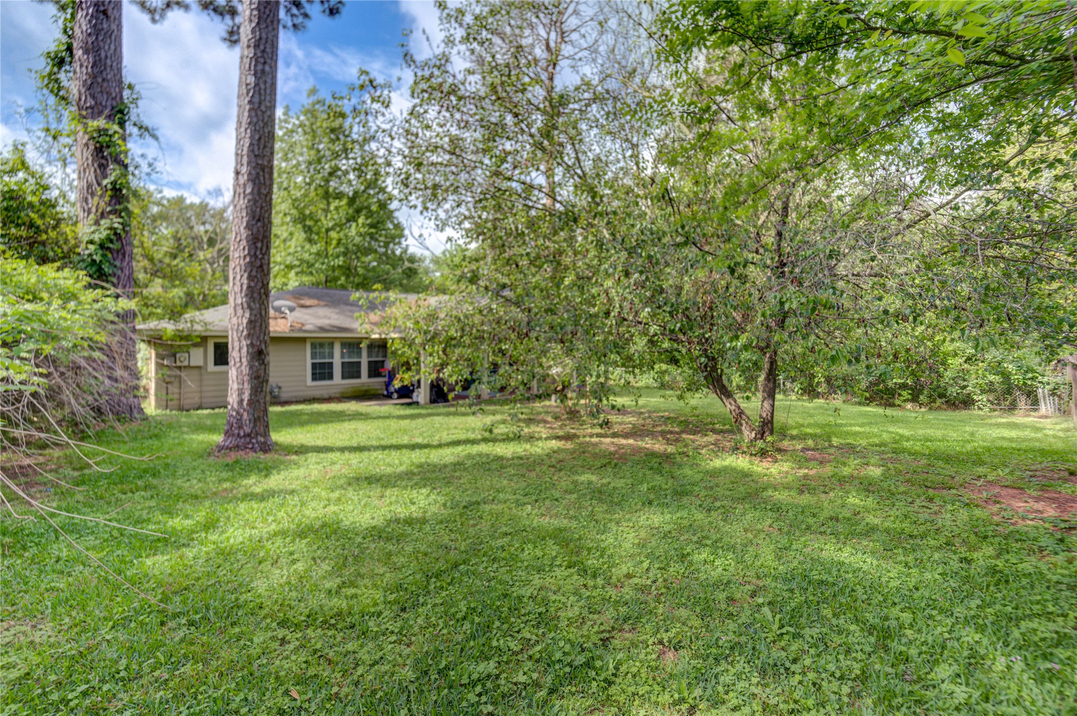 3530 Kentwood Drive Spring, TX 77380 - Photo 5 of 37 a view of a house with a backyard