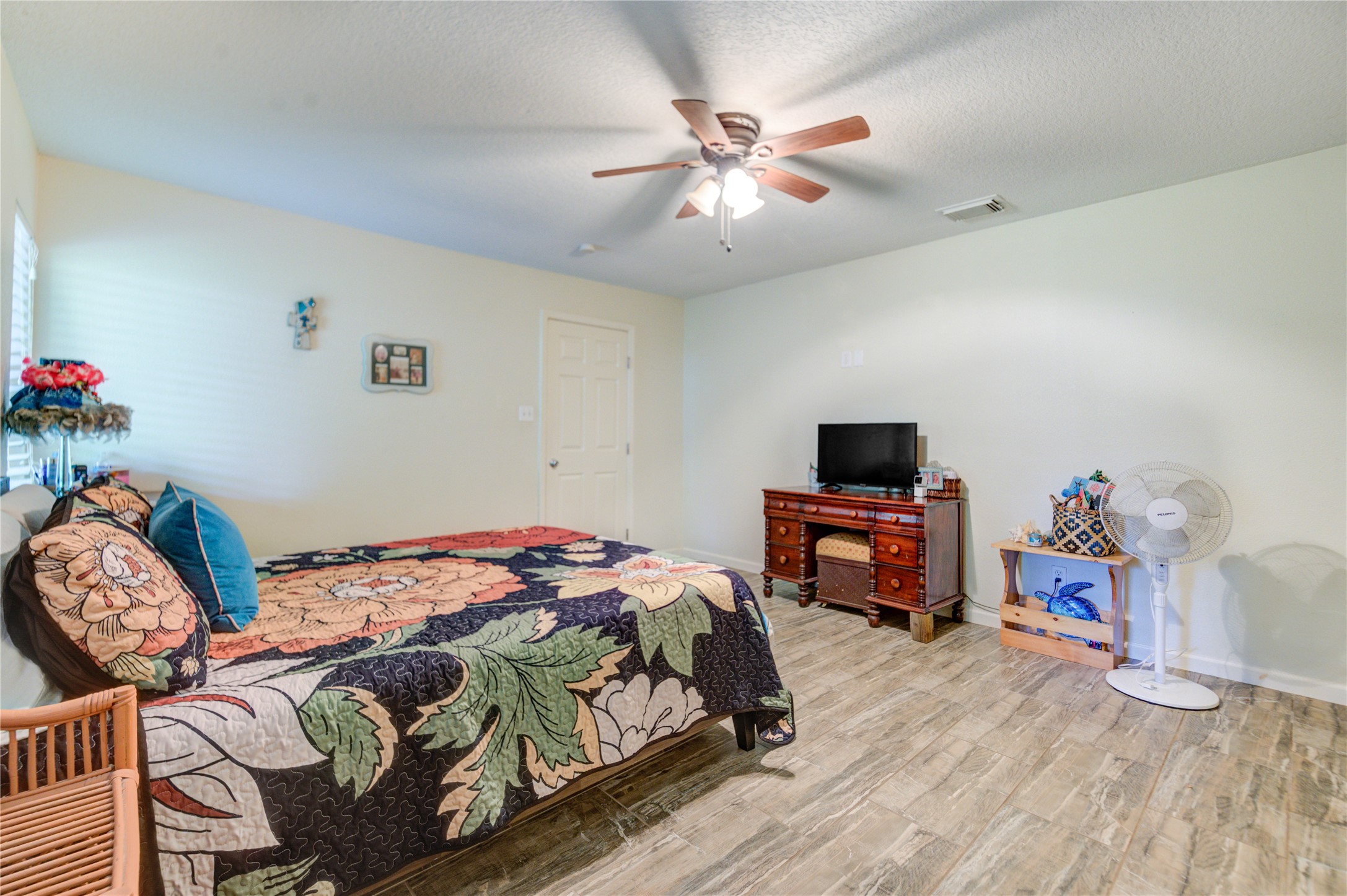 3530 Kentwood Drive Spring, TX 77380 - Photo 6 of 37 a bedroom with a bed and wooden floor
