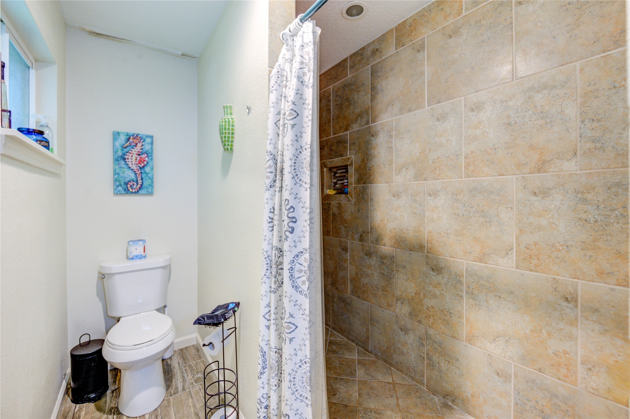 3530 Kentwood Drive Spring, TX 77380 - Photo 9 of 37 a white toilet sitting next to a shower curtain