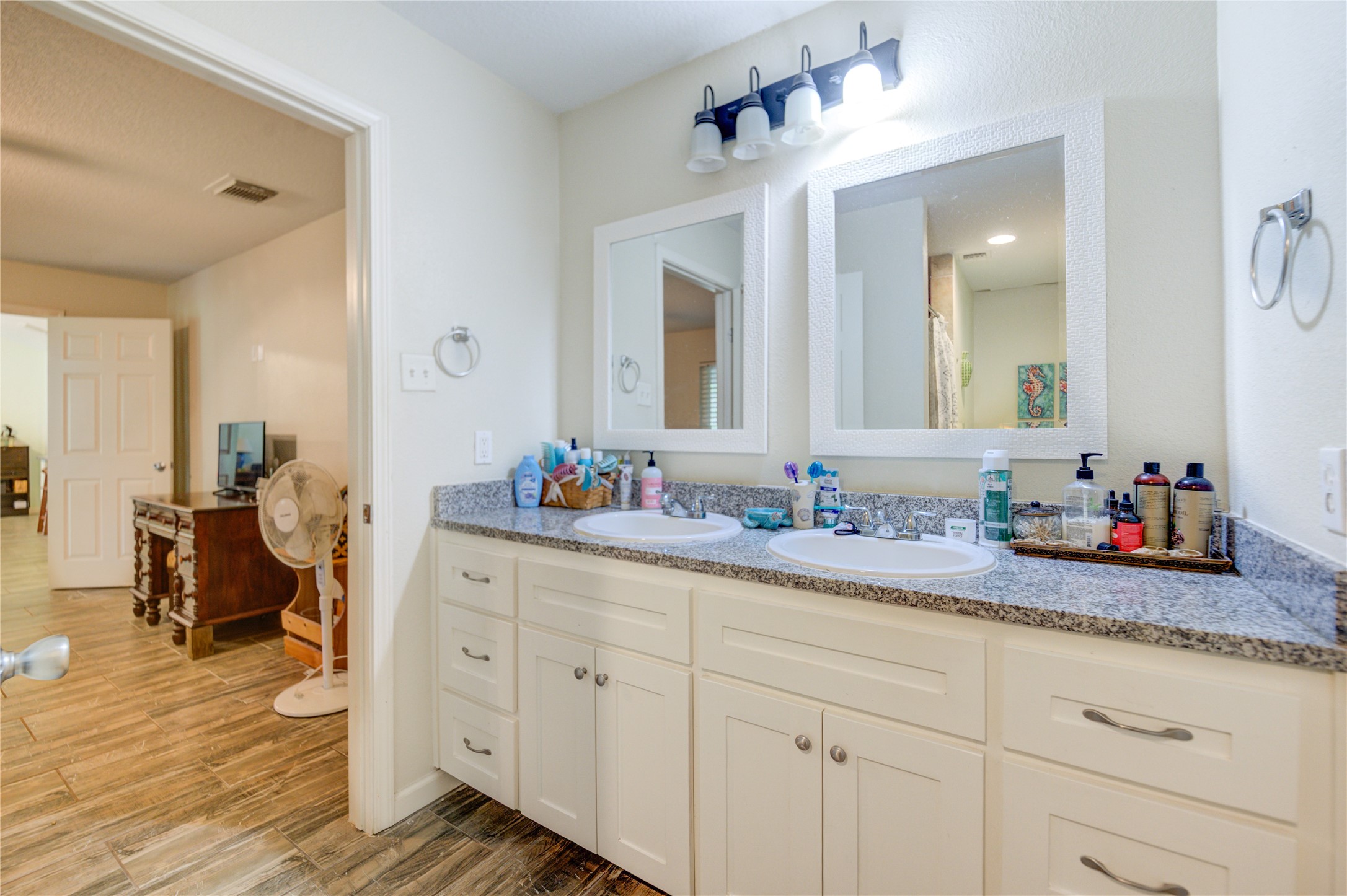 3530 Kentwood Drive Spring, TX 77380 - Photo 10 of 37 a bathroom with a granite countertop double vanity sink and a mirror
