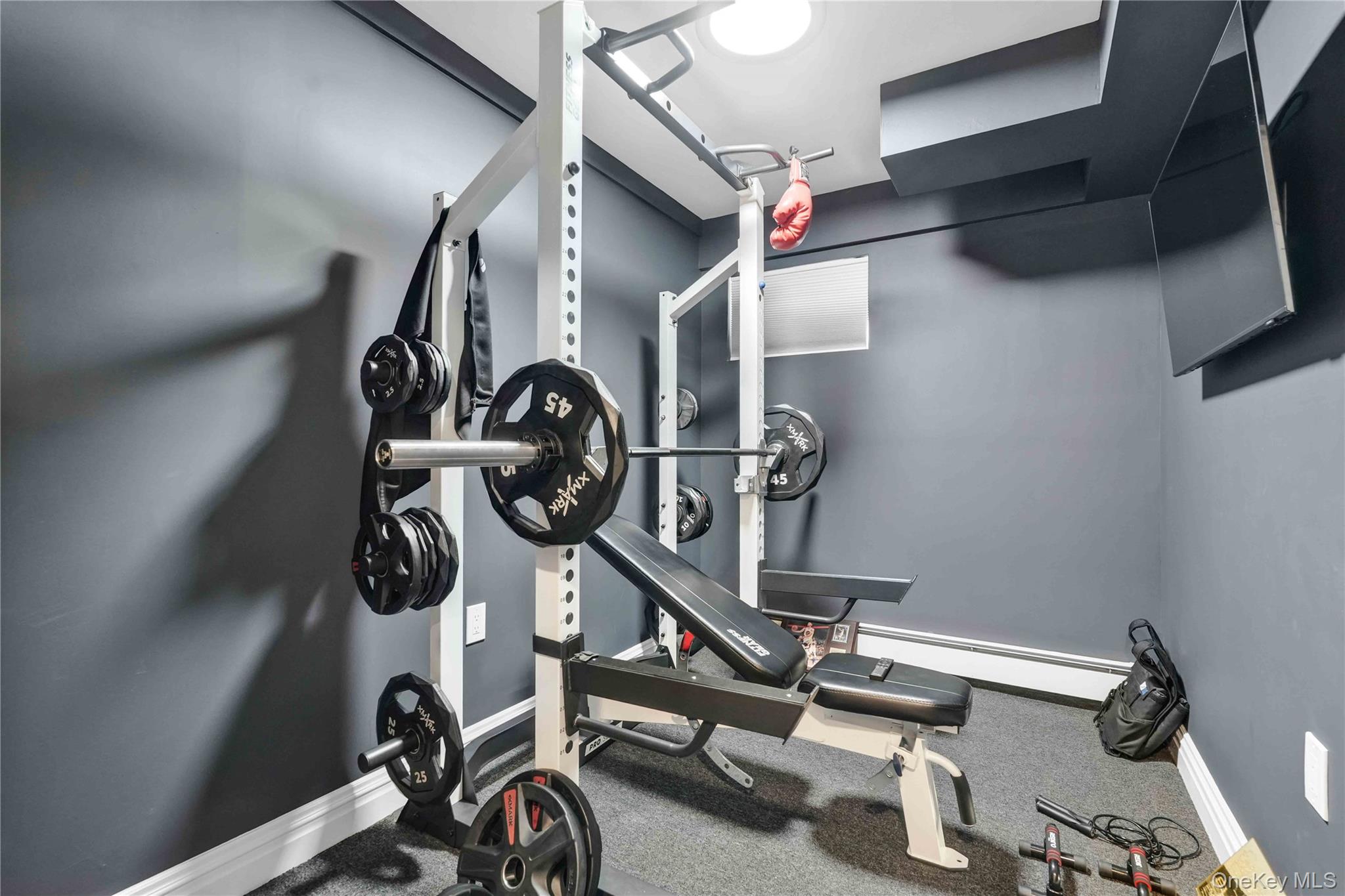 2 Amherst Lane Smithtown, NY 11787 - Photo 23 of 33 Exercise room featuring baseboards and a baseboard radiator