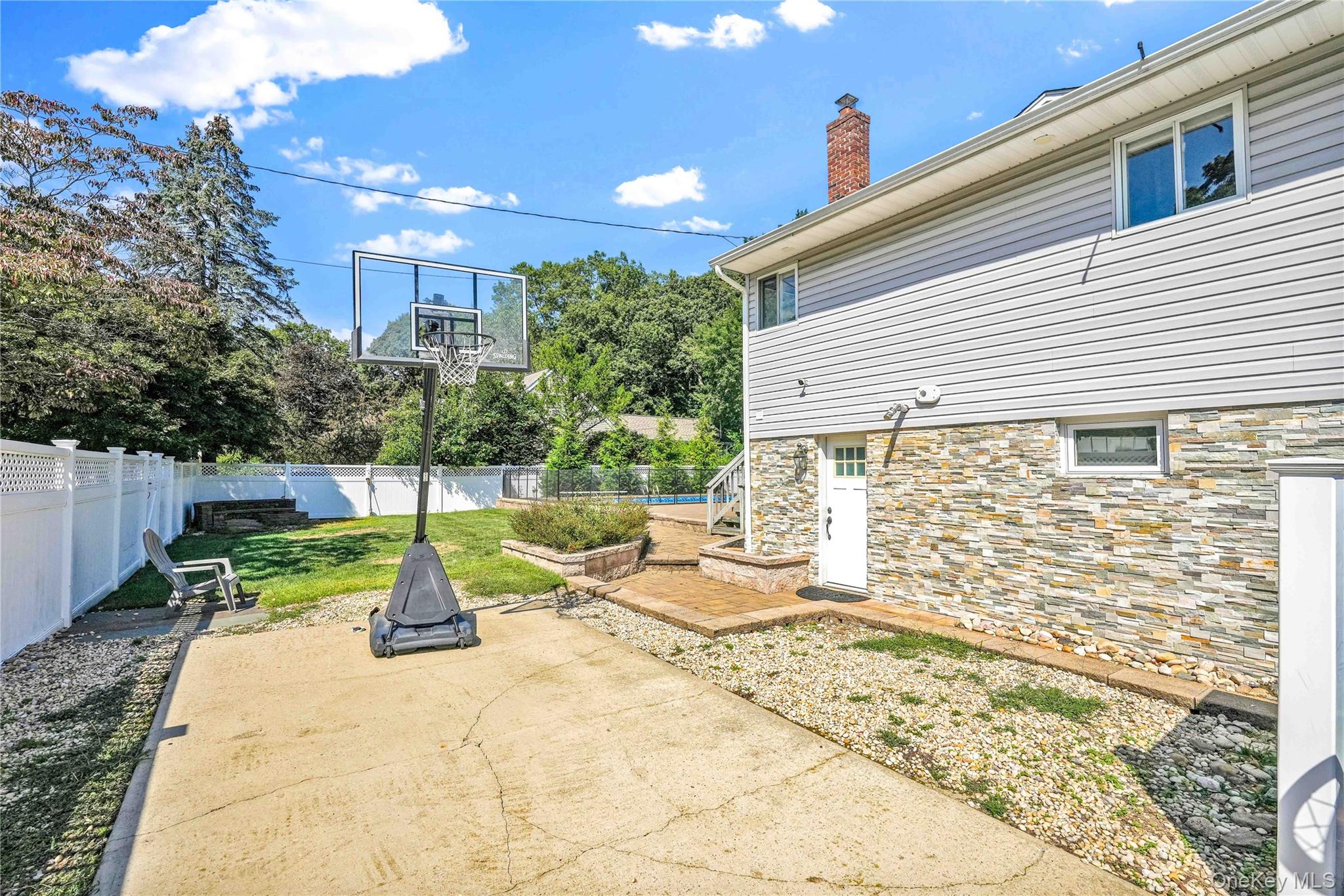 2 Amherst Lane Smithtown, NY 11787 - Photo 26 of 33 Fenced backyard featuring a patio