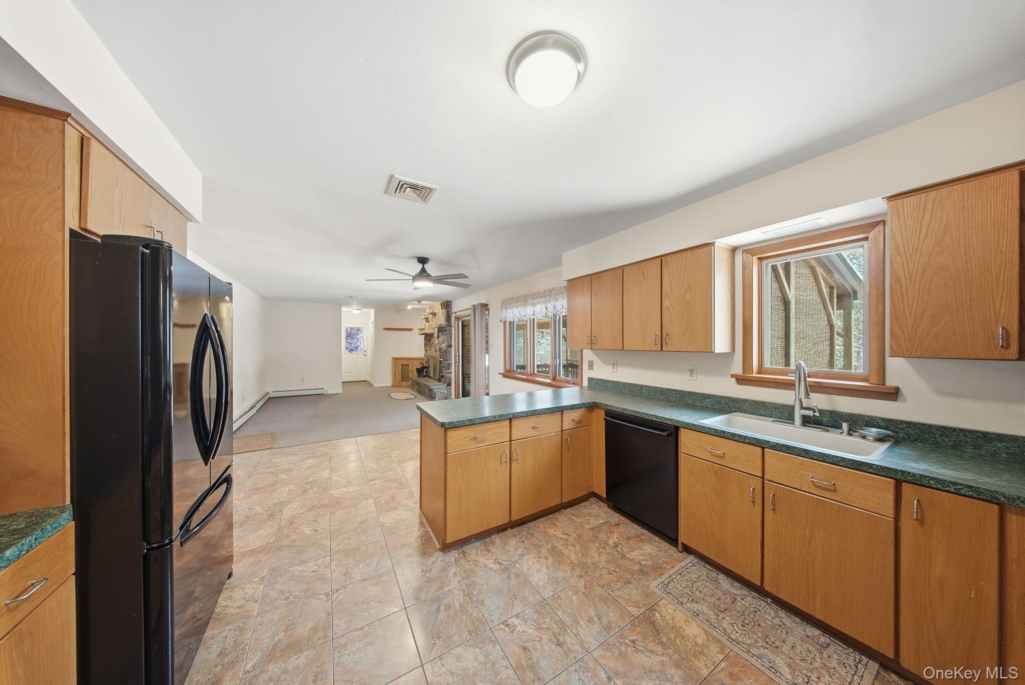 139 Renner Road Mountain Dale, NY 12763 - Photo 13 of 50 a kitchen with stainless steel appliances granite countertop a refrigerator and a sink