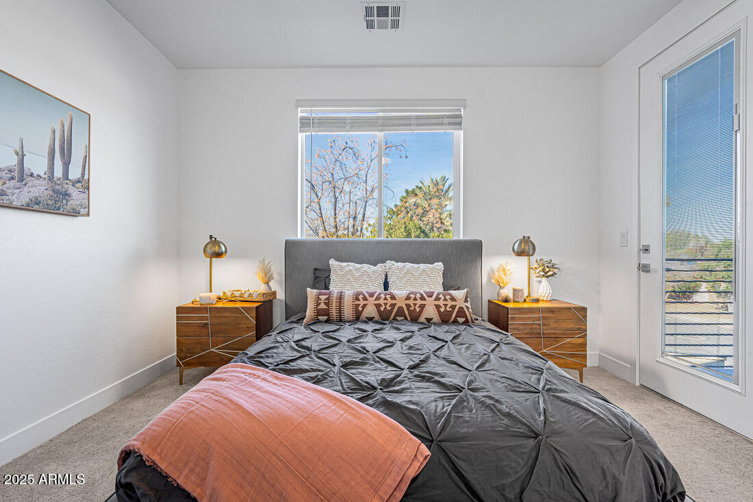 1247 East Colter Street, Unit 1 Phoenix, AZ 85014 - Photo 13 of 32 a bedroom with furniture and a window