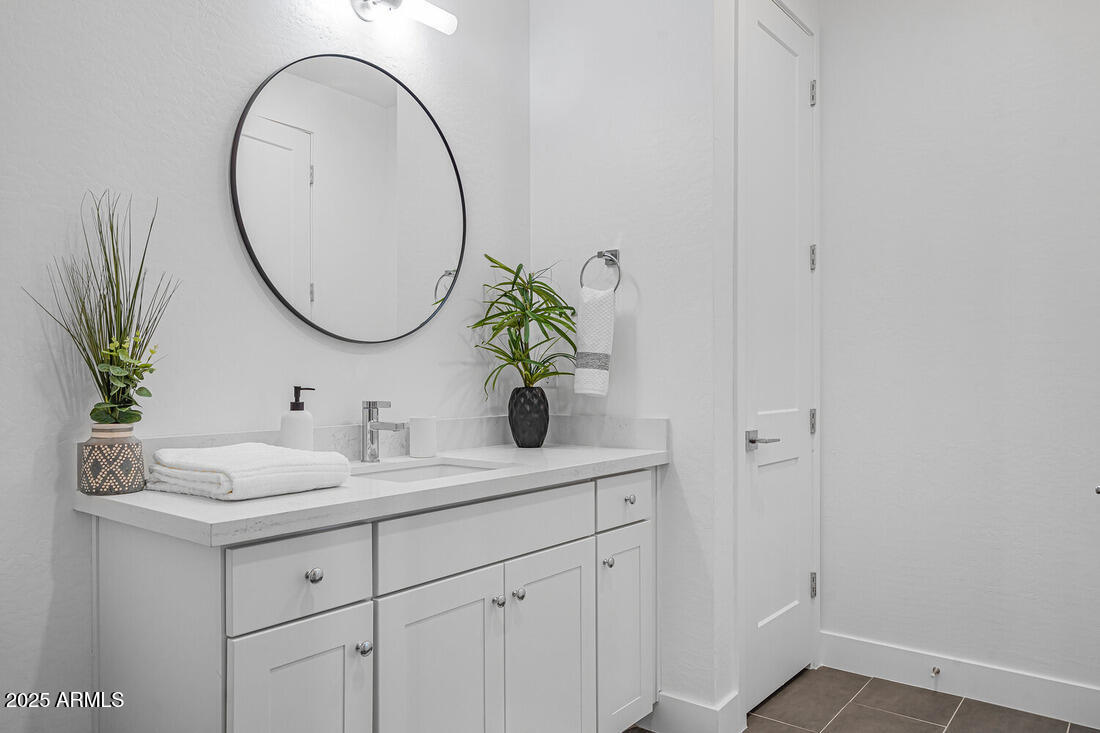 1247 East Colter Street, Unit 1 Phoenix, AZ 85014 - Photo 16 of 32 a bathroom with a sink and a mirror