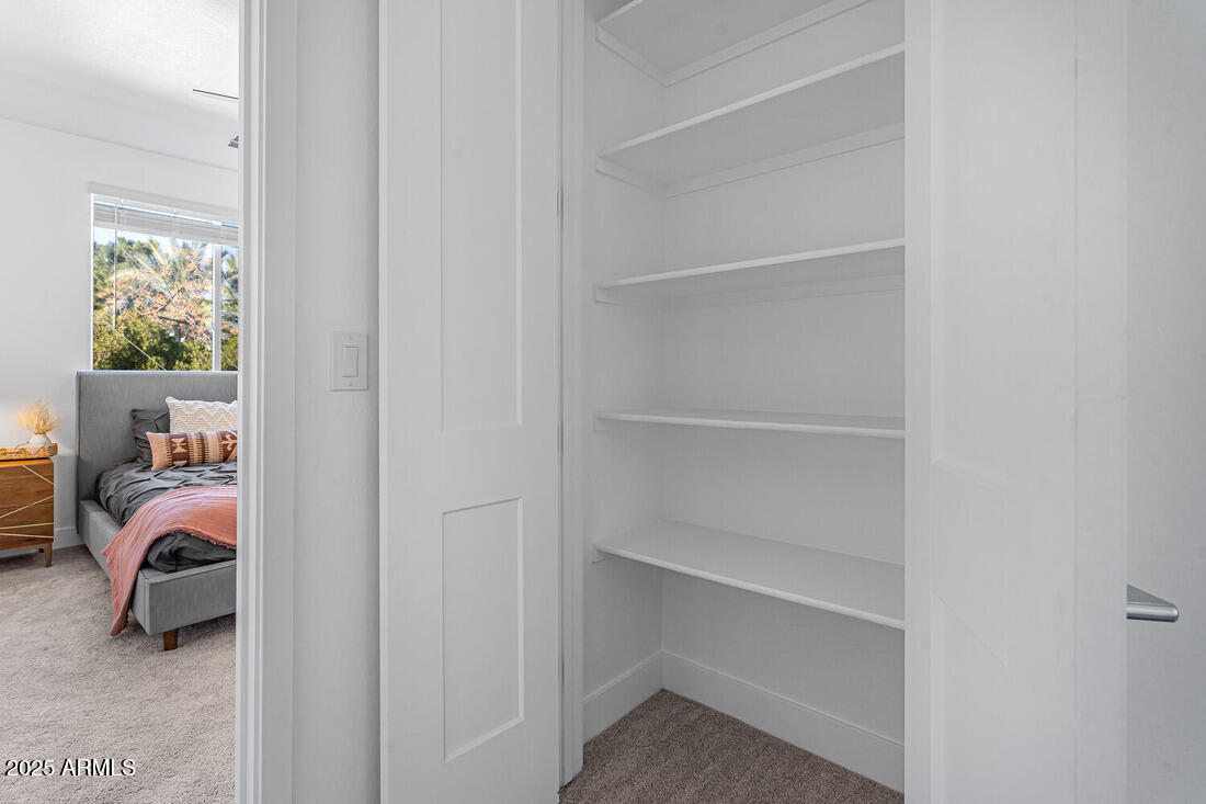1247 East Colter Street, Unit 1 Phoenix, AZ 85014 - Photo 19 of 32 a view of bedroom with furniture and closet