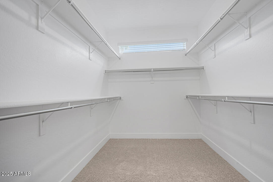 1247 East Colter Street, Unit 1 Phoenix, AZ 85014 - Photo 25 of 32 a view of an empty walk in closet