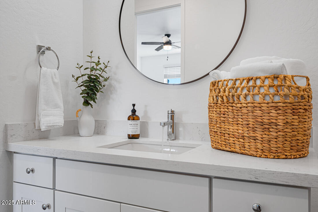 1247 East Colter Street, Unit 1 Phoenix, AZ 85014 - Photo 29 of 32 a bathroom with a sink and a mirror