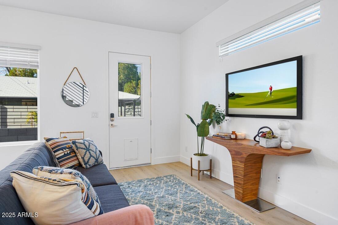 1247 East Colter Street, Unit 1 Phoenix, AZ 85014 - Photo 30 of 32 a living room with furniture and a window