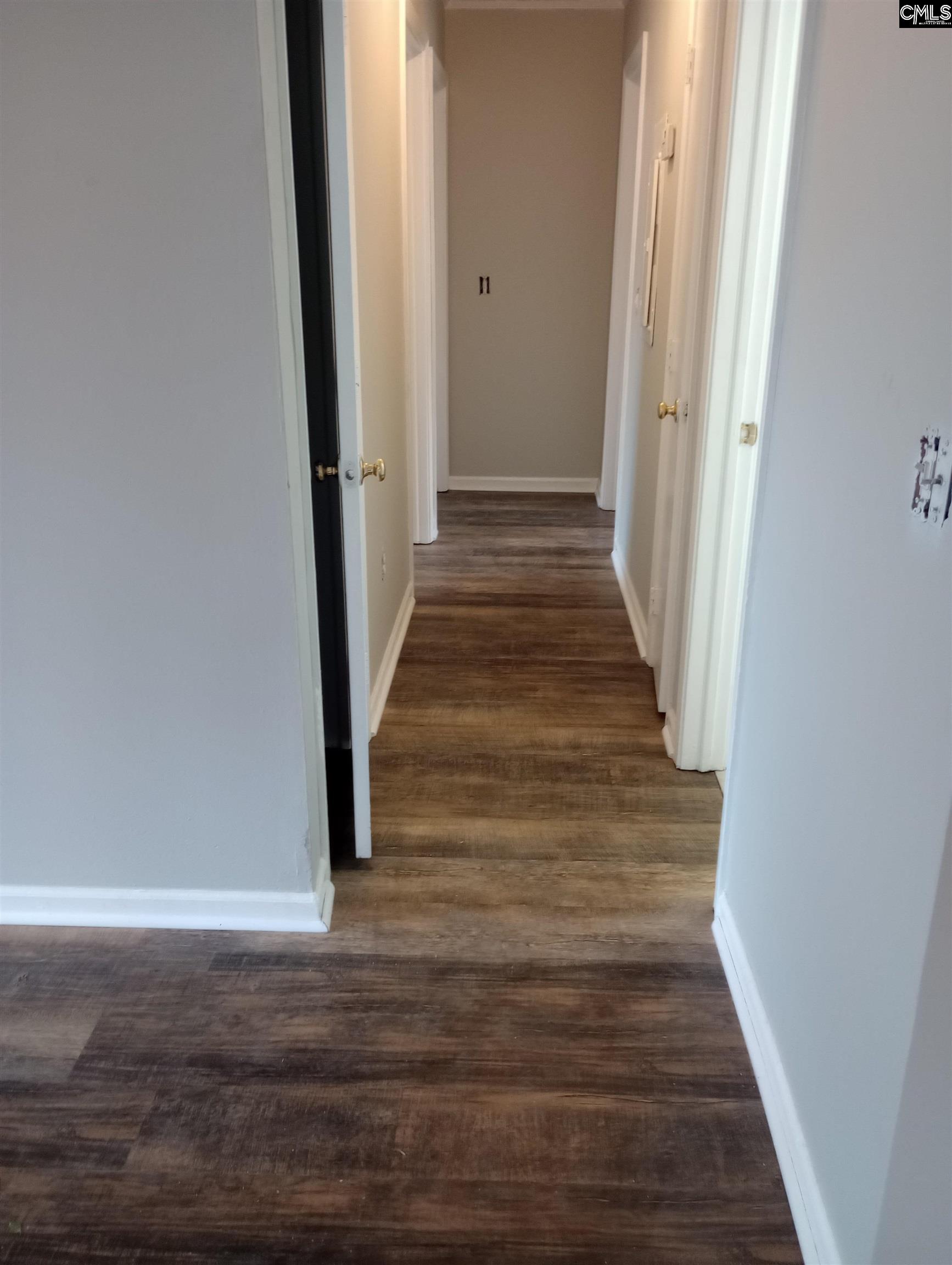 2444 Watson Street, Unit B Elgin, SC 29045 - Photo 3 of 5 a view of a hallway with wooden floor and staircase
