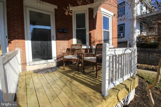 front view of a house with a large window
