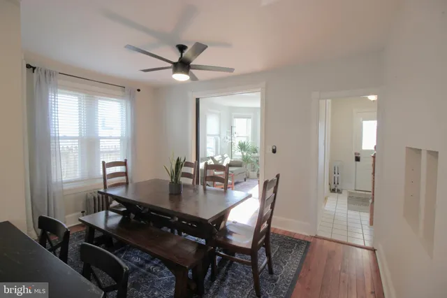 a view of a dining room with furniture and window