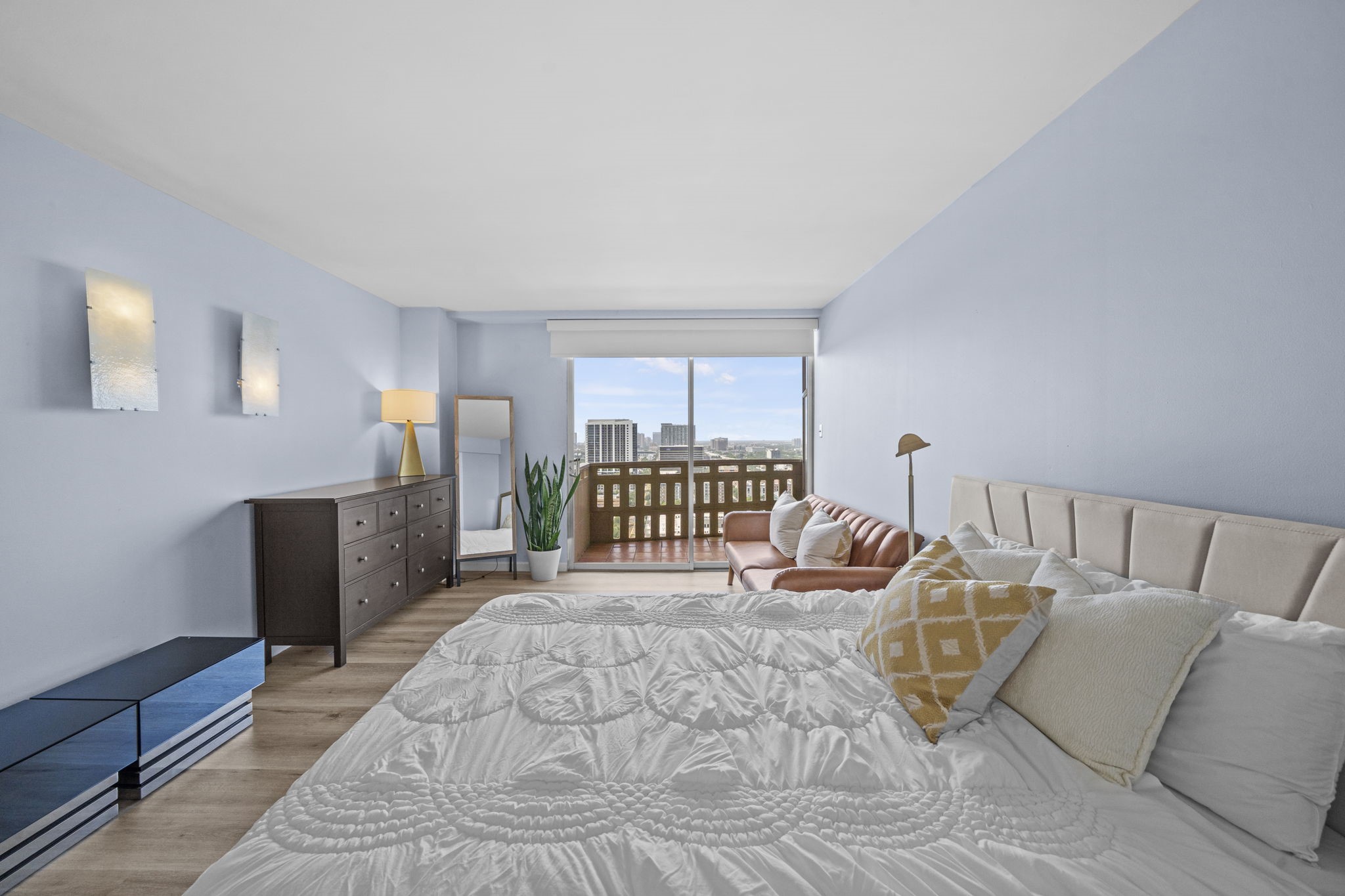 2016 Main Street, Unit 2302 Houston, TX 77002 - Photo 2 of 34 Spacious primary bedroom featuring abundant natural light, city views, and direct access to a private balcony.
