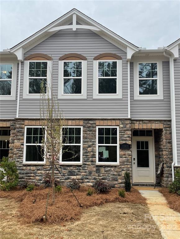 1346 Galloway Road Charlotte, NC 28262 - Photo 1 of 1 a view of a brick house with many windows