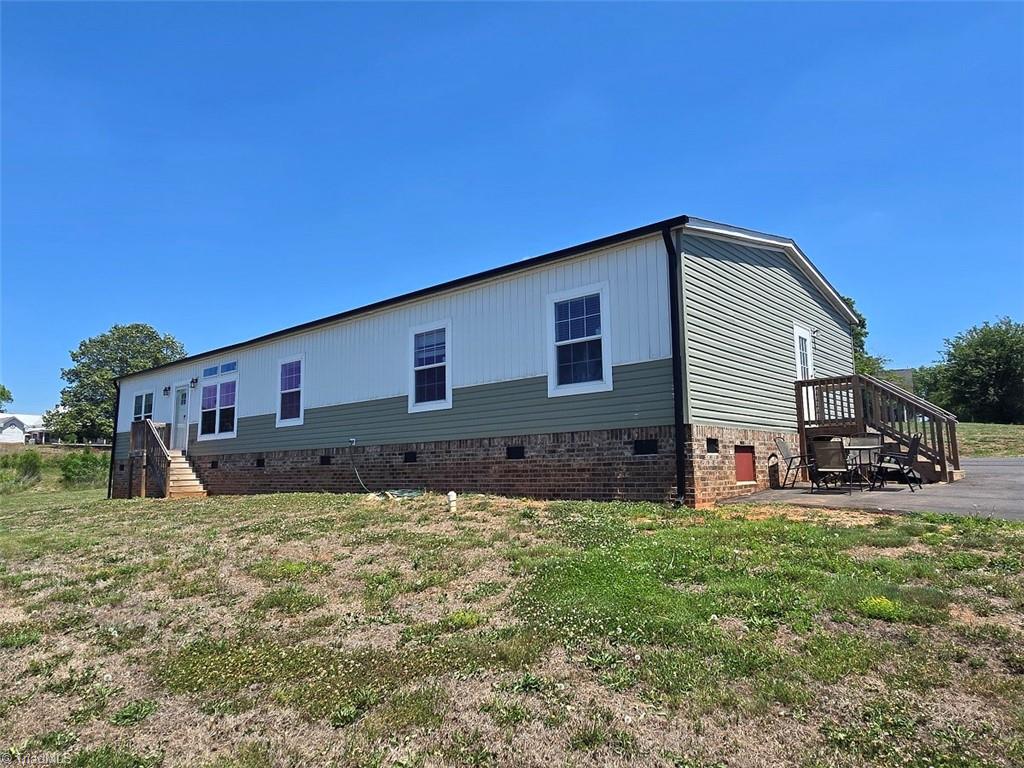 1266 Quaker Church Road Siloam, NC 27047 - Photo 2 of 29 Built in 2023, the home was put on site and then finished with drywall throughout in 2024