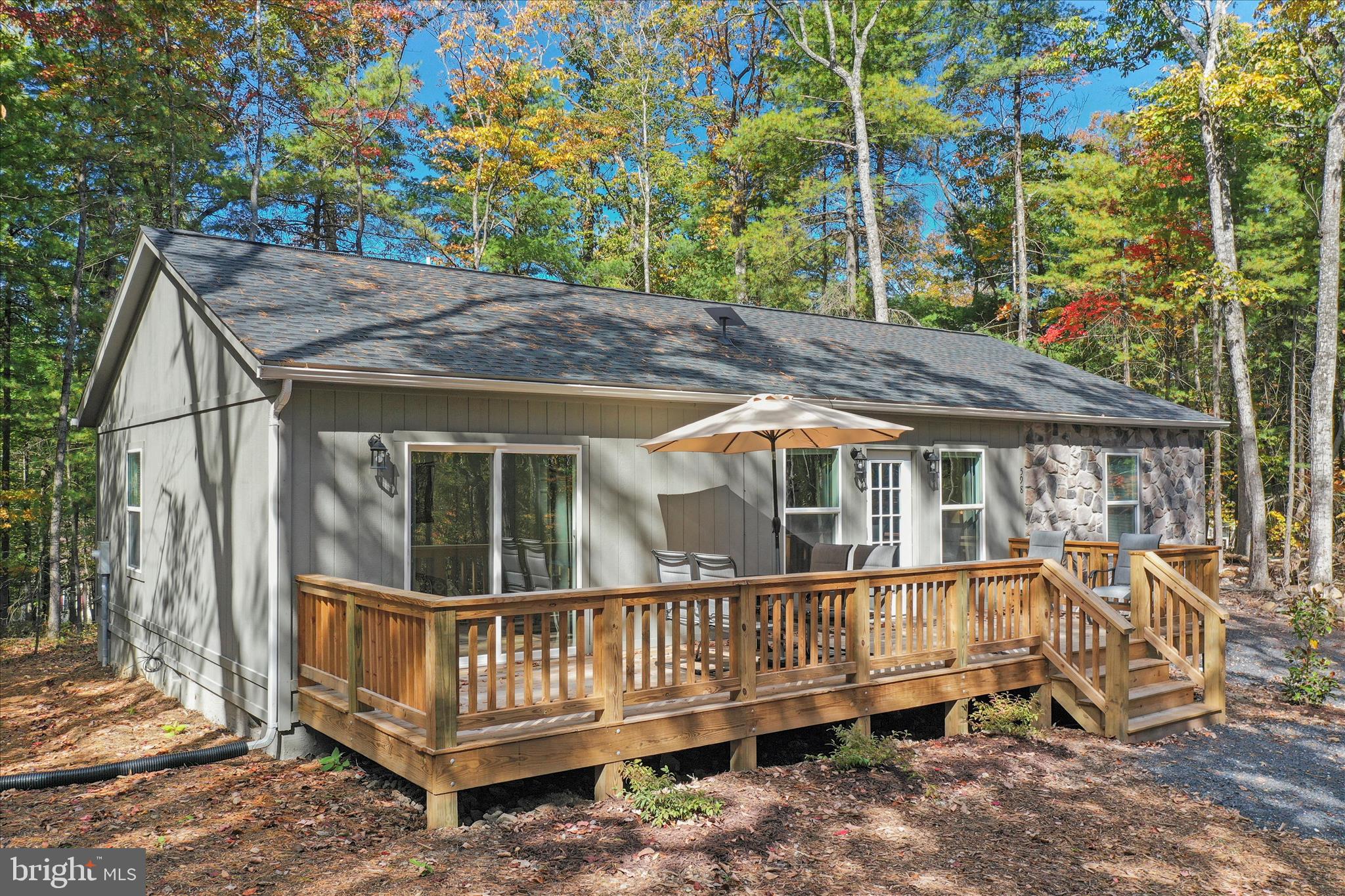 598 Crabapple Road Mount Jackson, VA 22842 - Photo 4 of 32 a view of a house with a wooden deck and furniture