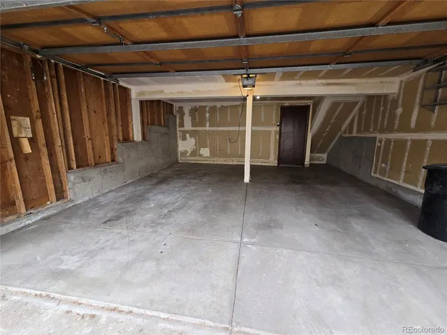 a view of an empty room with a fireplace